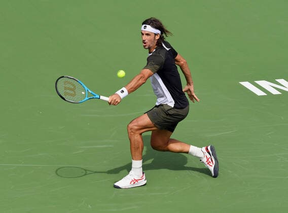 INDIAN WELLS, CA - OCTOBER 07: Feliciano Lopez of Spain hits a backhand shot during a tennis match played on October 7, 2021 at the BNP Paribas Open played at the Indian Wells Tennis Garden in Indian Wells, CA. (Photo by John Cordes Icon Sportswire) TENNIS: OCT 07 BNP Paribas Open Icon506211007045