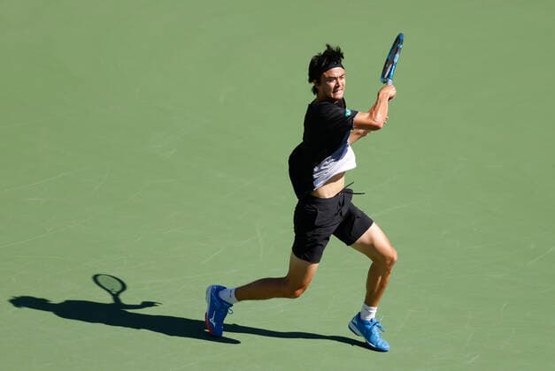 October 09, 2021 Taro Daniel of Japan returns a shot to Reilly Opelka at the 2021 BNP Paribas Open at Indian Wells Tennis Garden in Indian Wells, California. Mandatory Photo Credit : CSM Indian Wells United States of America - ZUMAc04_ 20211009_zaf_c04_063 Copyright: xCharlesxBausx