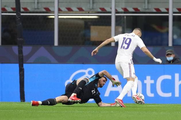 Milan, Italy, 10th October 2021. Karim Benzema of France takes the ball around Unai Simon of Spain only to have his subsequent shot cleared off the line during the UEFA Nations League match at Stadio Giuseppe Meazza, Milan. Picture credit should read: Jonathan Moscrop Sportimage EDITORIAL USE ONLY. No use with unauthorised audio, video, data, fixture lists, club league logos or live services. Online in-match use limited to 120 images, no video emulation. No use in betting, games or single club league player publications. SPI-1236-0005