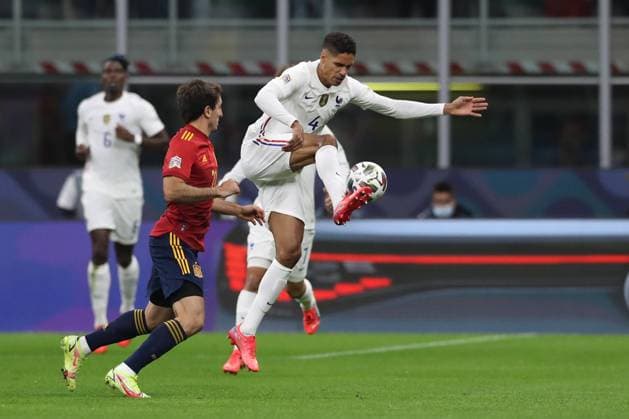 Milan, Italy, 10th October 2021. Raphael Varane of France anticipates Mikel Oyarzabal of Spain to the ball during the UEFA Nations League match at Stadio Giuseppe Meazza, Milan. Picture credit should read: Jonathan Moscrop Sportimage EDITORIAL USE ONLY. No use with unauthorised audio, video, data, fixture lists, club league logos or live services. Online in-match use limited to 120 images, no video emulation. No use in betting, games or single club league player publications. SPI-1236-0006