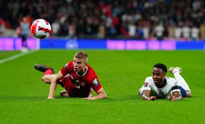 Mandatory Credit: Photo by Javier Garcia Shutterstock (12534018t) Andras Schafer of Hungary fouls Raheem Sterling of England England v Hungary, FIFA World Cup, WM, Weltmeisterschaft, Fussball 2022 Qualifying, Group I, Football, Wembley Stadium, London, UK - 12 Oct 2021 EDITORIAL USE ONLY No use with unauthorised audio, video, data, fixture lists, club league logos or live services. Online in-match use limited to 120 images, no video emulation. No use in betting, games or single club league player publications. England v Hungary, FIFA World Cup 2022 Qualifying, Group I, Football, Wembley Stadium, London, UK - 12 Oct 2021 EDITORIAL USE ONLY No use with unauthorised audio, video, data, fixture lists, club league logos or live services. Online in-match use limited to 120 images, no video emulation. No use in betting, games or single club league player publications.  Copyright: xJavierxGarcia Shutterstockx 12534018t