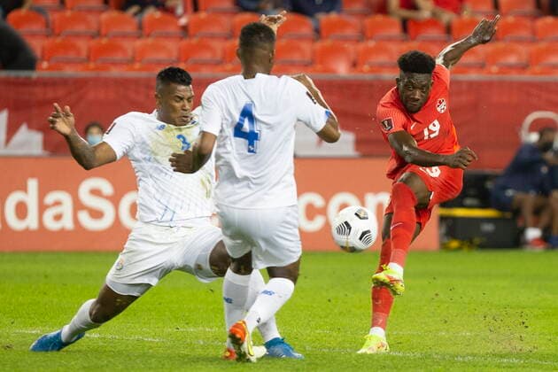 October 13, 2021, Toronto, on, Canada: Canada s Alphonso Davies (right) gets a shot away despite pressure from Panama s Harold Cummings (left) and Fidel Escobar during first half World Cup qualifying action in Toronto on Wednesday, October 13, 2021. Alphonso Davies; Harold Cummings; Fidel Escobar  - ZUMAc35_ 20211013_zaf_c35_069 Copyright: xChrisxYoungx