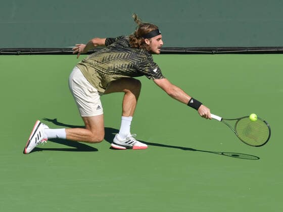 INDIAN WELLS, CA - OCTOBER 15: Stefanos Tsitsipas (GRE) hits a low backhand during his quarterfinal match at the BNP Paribas Open on October 15, 2021, at the Indian Wells Tennis Garden in Indian Wells, CA. (Photo by Cynthia Lum Icon Sportswire) TENNIS: OCT 15 BNP Paribas Open Icon2502110151241