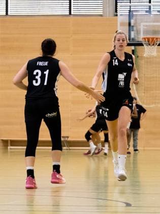 Duesseldorf, Germany, October 16 Fallyn Dee Freije (31 SNP Bascats) and Harriet Ottewill-Soulsby (14 SNP Bascats) celebrate three points during the 1. Toyota Damen Basketball Bundesliga game between the Capitol Bascats Duesseldorf and SNP Bascats USC Heidelberg at Wekita Sportarena in Duesseldorf Tatjana Herzberg SPP Capitol Bascats Duesseldorf v SNP Bascats USC Heidelberg, 1. Toyota Damen Basketball Bundes Game, Wekita Sportarena 