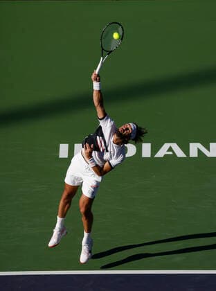 October 16, 2021 Nikoloz Basilashvili of Georgia serves to Taylor Fritz during the semifinals of the 2021 BNP Paribas Open at Indian Wells Tennis Garden in Indian Wells, California. Mandatory Photo Credit : CSM Indian Wells United States of America - ZUMAc04_ 20211016_zaf_c04_321 Copyright: xCharlesxBausx