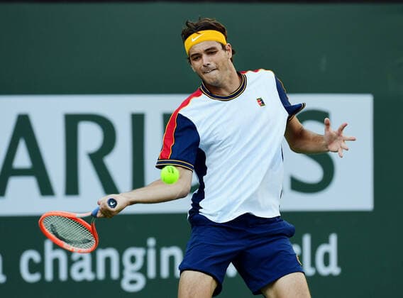 INDIAN WELLS, CA - OCTOBER 16: Taylor Fritz of the United States returns the ball during a semifinal tennis match played on October 16, 2021 at the BNP Paribas Open at the Indian Wells Tennis Garden in Indian Wells, CA. (Photo by John Cordes Icon Sportswire) TENNIS: OCT 16 BNP Paribas Open Icon506211016728
