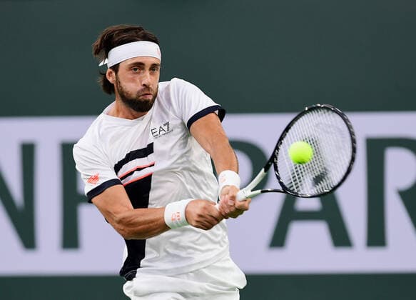 INDIAN WELLS, CA - OCTOBER 17: Nikoloz Basilashvili of Georgia returns the ball during a finals tennis match at the BNP Paribas Open played on October 17, 2021 at the Indian Wells Tennis Garden in Indian Wells, CA. (Photo by John Cordes Icon Sportswire) TENNIS: OCT 17 BNP Paribas Open Icon506211017929