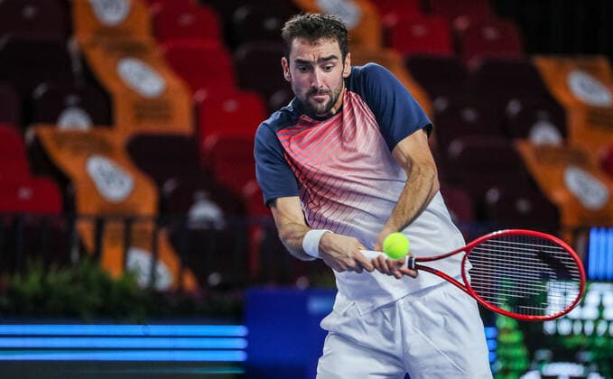 MOSCOW, RUSSIA - OCTOBER 18, 2021: Croatiaâ€™s Marin Cilic in action in his menâ€™s singles Round of 32 tennis match against Bosnia and Herzegovina s Damir Dzumhur at the VTB Kremlin Cup 2021 at the Luzhniki Palace of Sports. Mikhail Tereshchenko TASS  TS1149EB