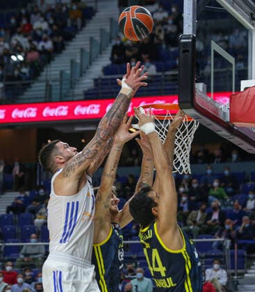 15th October 2021; Wizink Center; Madrid, Spain; Turkish Airlines Euroleague Basketball , Real Madrid versus Fenerbahce Beko Istanbul; Vincent Poirier (Real Madrid Baloncesto) challenges for the rebound against Nando De Colo and Ahmet Duverioglu (Fenerbahce Beko Istanbul)  ActionPlus12332408 AgenciaLOF