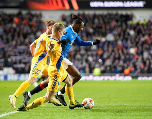 Mandatory Credit: Photo by Stuart Wallace Shutterstock (12547363as) Sigurd Rosted of Brondby appears to foul Joe Aribo of Rangers as he challenges him inside the Brondby penalty area. Referee Fran Jovic allowed play to continue and there was no VAR check. Rangers v Brondby, UEFA Europa League, Group A, Football, Ibrox Stadium, Glasgow, UK - 21 Oct 2021 EDITORIAL USE ONLY No use with unauthorised audio, video, data, fixture lists, club league logos or live services. Online in-match use limited to 120 images, no video emulation. No use in betting, games or single club league player publications. Rangers v Brondby, UEFA Europa League, Group A, Football, Ibrox Stadium, Glasgow, UK - 21 Oct 2021 EDITORIAL USE ONLY No use with unauthorised audio, video, data, fixture lists, club league logos or live services. Online in-match use limited to 120 images, no video emulation. No use in betting, games or single club league player publications. Copyright: xStuartxWallace Shutterstockx 12547363as