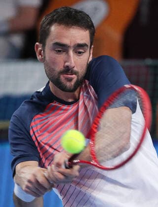 MOSCOW, RUSSIA - OCTOBER 22, 2021: Croatiaâ€™s Marin Cilic in action in his menâ€™s singles quarterfinal tennis match against Spain s Pedro Martinez at the VTB Kremlin Cup 2021 at Irina Viner-Usmanova Rhythmic gymnastics, Rhythmische Sportgymnastik, RSG Center. Mikhail Tereshchenko TASS  TS11539B