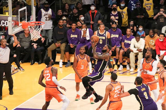 October 22, 2021, Los Angeles, California, USA: Lakers LeBron James puts up this shot over multiple Suns defenders during the contest as the host Los Angeles Lakers fall to the visiting Phoenix Suns 105-115 on Friday, October 22, 2021 at The Staples Center in Los Angeles, California. PI Los Angeles USA - ZUMAp124 20211022_zaa_p124_036 Copyright: xBURTxHARRISx