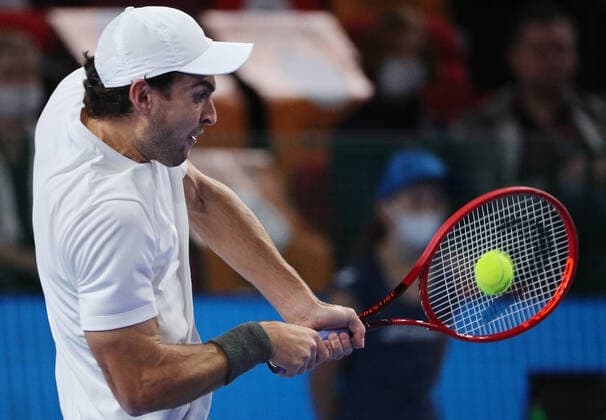 MOSCOW, RUSSIA - OCTOBER 24, 2021: Russia s Aslan Karatsev returns the ball in his singles final match against Croatia s Marin Cilic at the VTB Kremlin Cup 2021 international tennis tournament at the Irina Viner-Usmanova Gymnastics Palace. Mikhail Tereshchenko TASS  TS11585D