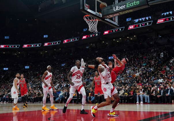 October 25, 2021, Toronto, on, Canada: Chicago Bulls guard Alex Caruso (6) gets fouled by Toronto Raptors guard Gary Trent Jr. (33) as Raptors forward Chris Boucher (25) looks on during first half NBA, Basketball Herren, USA basketball action in Toronto, Monday, Oct. 25, 2021. Canada News - October 25, 2021  - ZUMAc35_ 20211025_zaf_c35_090 Copyright: xNathanxDenettex