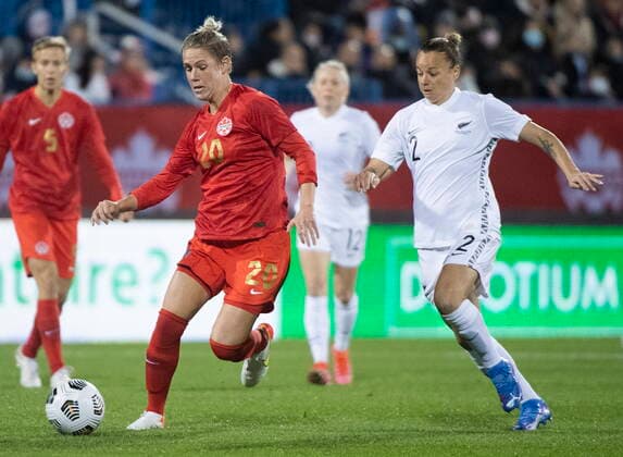 October 26, 2021, Montreal, PQ, Canada: Canada™s Sophie Schmidt (20) breaks away from New Zealand™s Ria Percival (2) during first half Celebration Tour soccer action in Montreal, Tuesday, October 26, 2021. Ria Percival, Sophie Schmidt,  - ZUMAc35_ 20211026_zaf_c35_317 Copyright: xGrahamxHughesx