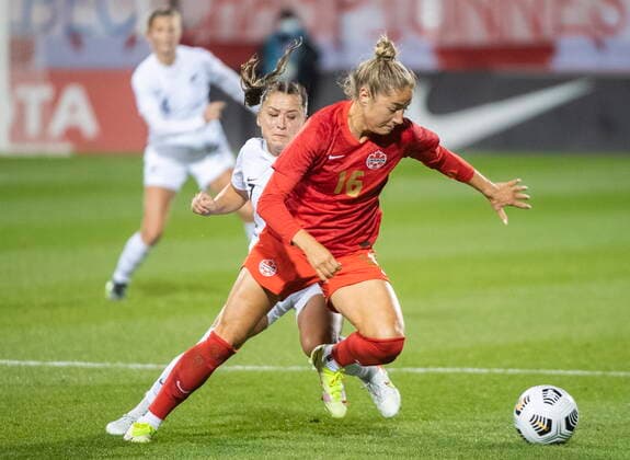 October 26, 2021, Montreal, PQ, Canada: Canada™s Janine Beckie, right, breaks away from New Zealand™s Olivia Chance during first half Celebration Tour soccer action in Montreal, Tuesday, October 26, 2021. Janine Beckie, Olivia Chance,  - ZUMAc35_ 20211026_zaf_c35_320 Copyright: xGrahamxHughesx