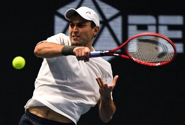 6683396 28.10.2021 Russia s Aslan Karatsev returns the ball during the men s singles 2nd round tennis match against Australia s John Millman at the St. Petersburg Open international tournament at Sibur Arena, in St. Petersburg, Japan. Alexander Galperin Sputnik Russia Tennis St Petersburg Open  cd717a4f3eac4f50