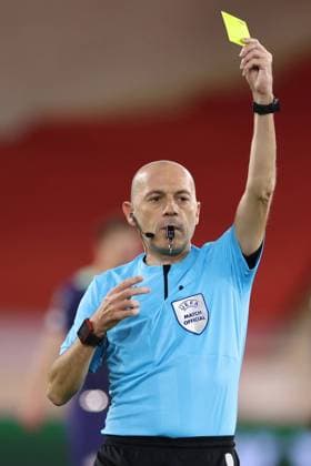 Monaco, Monaco, 4th November 2021. The referee Cuneyt Cakir of Turkey shows a yellow card during the UEFA Europa League match at Stade Louis II, Monaco. Picture credit should read: Jonathan Moscrop Sportimage EDITORIAL USE ONLY. No use with unauthorised audio, video, data, fixture lists, club league logos or live services. Online in-match use limited to 120 images, no video emulation. No use in betting, games or single club league player publications. SPI-1284-0005