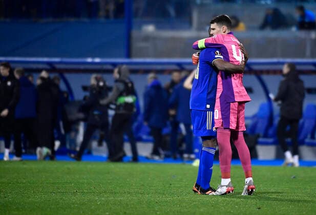 Dinamo Zagreb v Rapid Wien: Group H - UEFA Europa League Kevin Theophile Catherine of Dinamo Zagreb and Goalkeeper Dominik Livakovic of Dinamo Zagreb celebrate after the UEFA Europa League group H match between Dinamo Zagreb and Rapid Wien at Maksimir Stadium on November 4, 2021 in Zagreb, Croatia. MarkoxLukunic PIXSELL