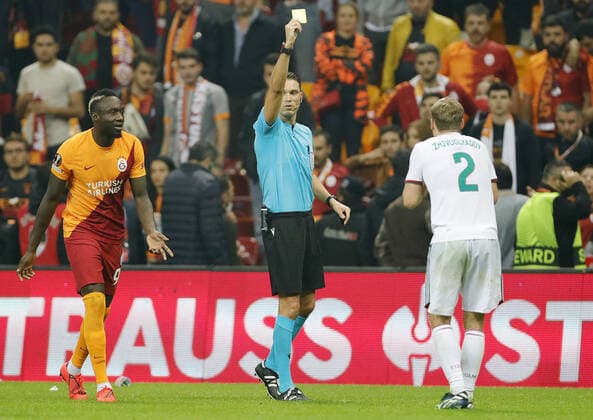 ISTANBUL, TURKEY - NOVEMBER 4, 2021: Galatasaray s Mbaye Diagne (L) and Lokomotivâ€™s Dmitry Zhivoglyadov (R) receive the yellow cards in the 2021 22 UEFA Europa League Group E Round 4 match between Galatasaray Istanbul and Lokomotiv Moscow at the Ali Sami Yen Sports Complex. Mikhail Japaridze TASS  TS116D29
