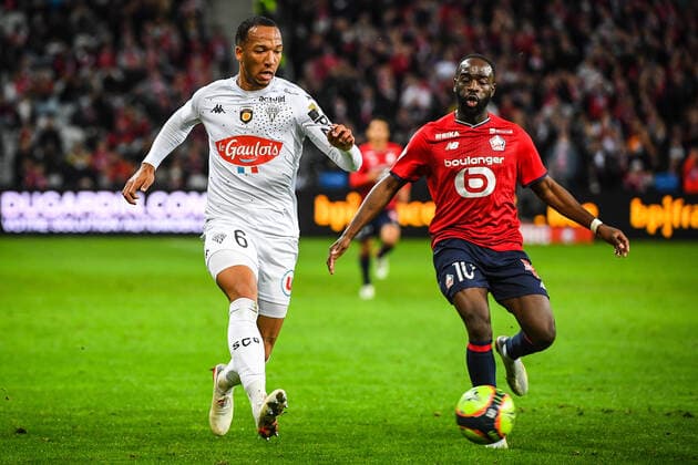 Enzo EBOSSE of Angers and Jonathan IKONE of Lille FOOTBALL : Lille OSC vs Angers SCO - Ligue 1 Uber Eats - 06 11 2021 MatthieuMirville Panoramic 