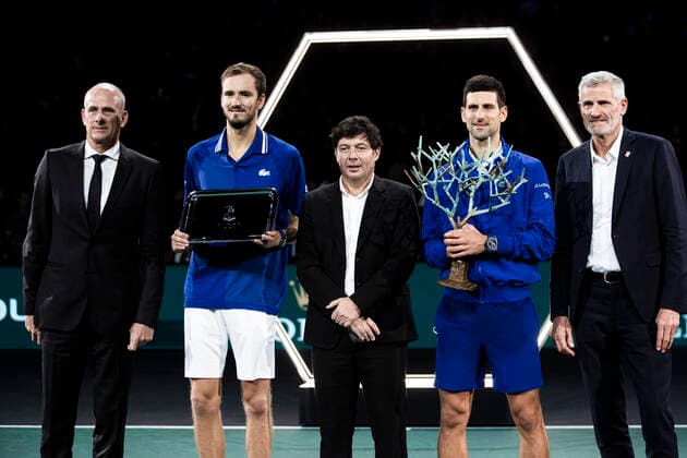 Paris, France, November 7, 2021 - Novak Djokovic of Serbia and Daniil Medvedev of Russia pose with their trophies presented by Sebastien Grosjean after the men s single final tennis match of the Rolex Paris Masters tournament.  Copyright: xAlexisxSciardx