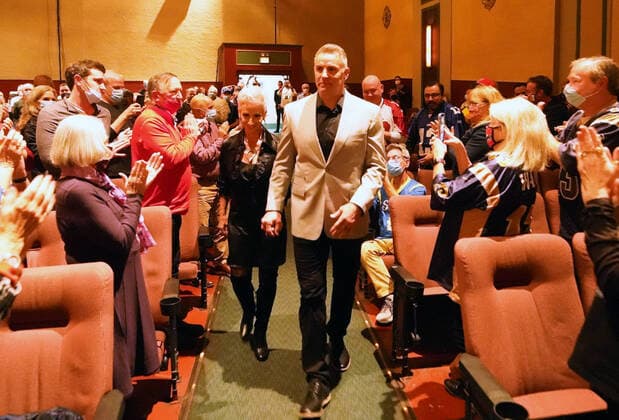 Kurt and Brenda Warner enter the Tivoli Theater for the new movie featuring Warner, American Underdog, in University City, Missouri on Monday, November 8, 2021. The movie depicts Warner from a supermarket clerk to a Super Bowl Champion with the St. Louis Rams.  SLP2021110897 BILLxGREENBLATT