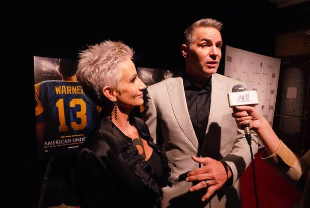 Kurt and Brenda Warner stop to talk to reporters on the red carpet during a special screening of the new movie featuring Warner, American Underdog, at the Tivoli Theater in University City, Missouri on Monday, November 8, 2021. The movie depicts Warner from a supermarket clerk to a Super Bowl Champion with the St. Louis Rams.  SLP2021110899 BILLxGREENBLATT