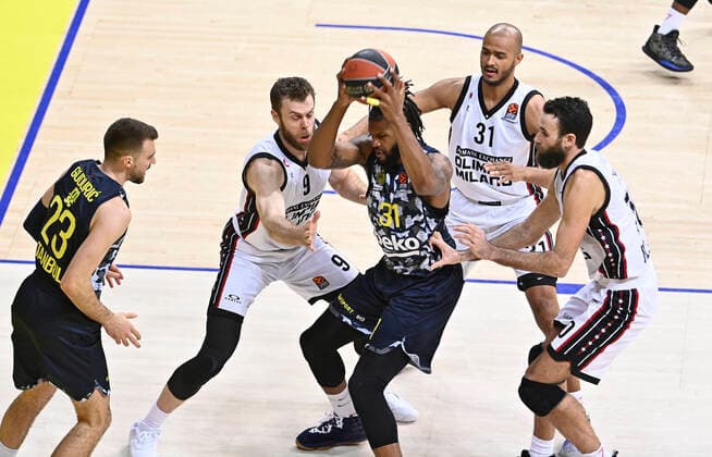 Devin Booker of Fenerbahce Beko Istanbul and Nicolo Melli , (L) , Luigi Datome (R) , Shavon Shields (c) of Ax Armani Exchange Milan during the Turkish Airlines Euroleague match between Fenerbahce Beko Istanbul and Ax Armani Exchange Milan at Ulker Arena in Istanbul , Turkey on November 12 , 2021. 