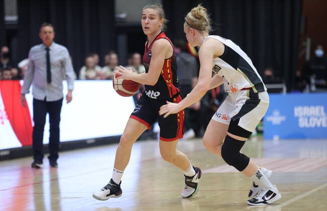 Belgium s Elise Ramette and Germany s Sonja Greinacher fight for the ball during a basketball game between Belgian national basket team the Belgian Cats and Germany, Sunday 14 November 2021 in Kortrijk, a qualifier for the FIBA Women s EuroBasket 2023 tournament. VIRGINIExLEFOUR  x3136156x