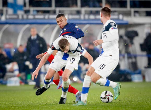 Kylian Mbappé of France Robert Ivanov of Finland and Leo Väisänen of Finland during their FIFA World Cup, WM, Weltmeisterschaft, Fussball Qualifier group D match Finland - France at the Helsinki Olympic Stadium on 17 November 2021 in Helsinki, Finland. (Kalle Parkkinen Newspix24)  Copyright: xKallexParkkinenx np2417322613258