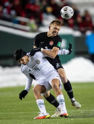 November 16, 2021, EDMONTON, ab, Canada: Canada s Alistair Johnston (2) and Mexico s Edson Omar Alvarez Velazquez (4) via for the ball during World Cup Qualifiers in Edmonton, Tuesday, Nov. 16, 2021. Alistair Johnston Edson Omar Alvarez Velazquez  - ZUMAc35_ 20211116_zaf_c35_172 Copyright: xJasonxFransonx