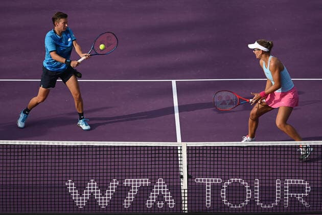 (211117) -- GUADALAJARA, Nov. 17, 2021 -- Nicole Melichar-Martinez (R) of the United States Demi Schuurs of the Netherlands compete during the women s doubles semifinal against Katerina Siniakova and Barbora Krejcikova of the Czech Republic at the AKRON WTA, Tennis Damen Finals in Guadalajara, Mexico, on Nov. 16, 2021. (Photo by Regina Cortina Xinhua) (SP)MEXICO-GUADALAJARA-TENNIS-WTA FINALS-DOUBLES XinxYuewei 