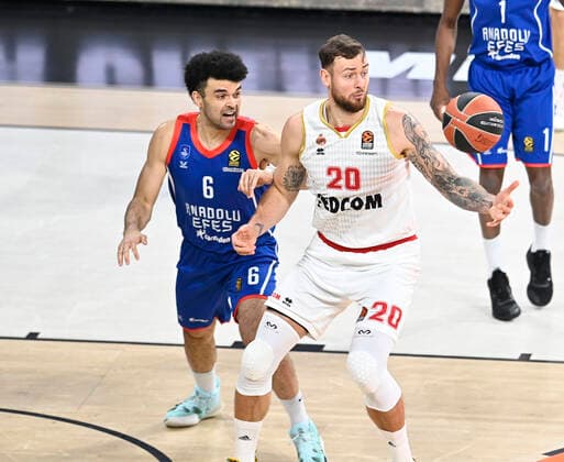 Elijah Bryant (6) of Anadolu Efes Istanbul and Donatas Motiejunas (20) of AS Monaco during the Turkish Airlines Euroleague match between Anadolu Efes Istanbul and As Monaco at Sinan Erdem Arena in Istanbul , Turkey on November 19 , 2021. 