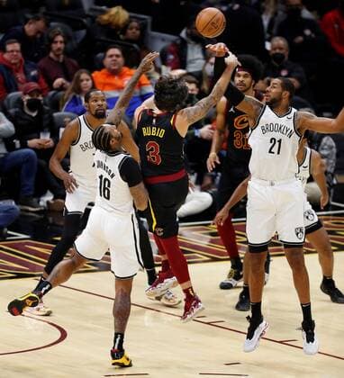 Cleveland Cavaliers guard Ricky Rubio (C) of Spain puts a shot up as he is guarded by (from left) Kevin Durant , James Johnson , and LaMarcus Aldridge of the Brooklyn Nets during the second half of the NBA, Basketball Herren, USA game between the Cleveland Cavaliers and the Brooklyn Nets at Rocket Mortgage Fieldhouse in Cleveland, Ohio, USA, 22 November 2021. Brooklyn Nets at Cleveland Cavaliers !ACHTUNG: NUR REDAKTIONELLE NUTZUNG!  Copyright: xDAVIDxMAXWELLx AME9705 20211123-4c2000e6fceee5722b192f4c2502de2739515bc8