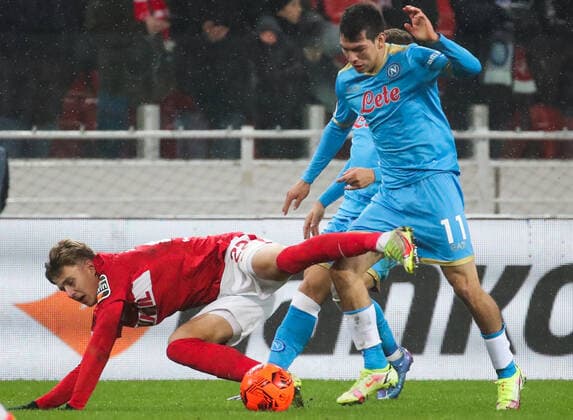 MOSCOW, RUSSIA - NOVEMBER 24, 2021: Spartak s Mikhail Ignatov (L) and Napoli s Hirving Lozano in action in the 2021 22 UEFA Europa League Group C Round 5 match between Spartak Moscow and SSC Napoli at Otkrytie Bank Arena. Sergei Fadeichev TASS  TS119340