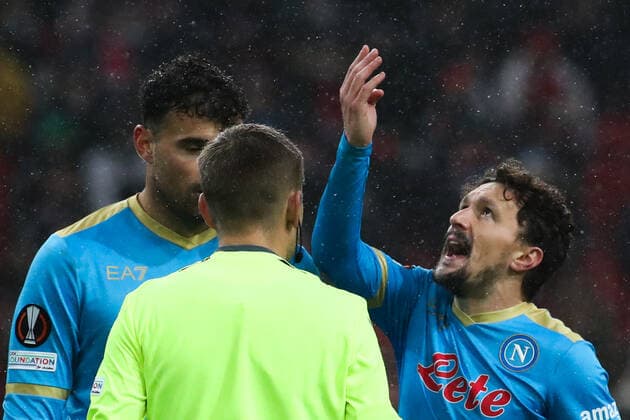 MOSCOW, RUSSIA â€“ NOVEMBER 24, 2021: SSC Napoli s Andrea Petagna (L), Mario Rui (R) talks to referee Clement Turpin (C) in their 2021 22 UEFA Europa League Group C football match against FC Spartak Moscow at Otkrytie Bank Arena Stadium. Sergei Fadeichev TASS  TS11938A