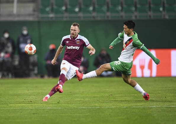 Mandatory Credit: Photo by Simon Dael Shutterstock (12617584z) Vladimir Coufal of West Ham and Koya Kitagawa of Rapid Vienna Rapid Vienna v West Ham United, UEFA Europa League, Group H, Football, Weststadion, Vienna, Austria - 25 Nov 2021 EDITORIAL USE ONLY No use with unauthorised audio, video, data, fixture lists, club league logos or live services. Online in-match use limited to 120 images, no video emulation. No use in betting, games or single club league player publications. Rapid Vienna v West Ham United, UEFA Europa League, Group H, Football, Weststadion, Vienna, Austria - 25 Nov 2021 EDITORIAL USE ONLY No use with unauthorised audio, video, data, fixture lists, club league logos or live services. Online in-match use limited to 120 images, no video emulation. No use in betting, games or single club league player publications. Copyright: xSimonxDael Shutterstockx 12617584z