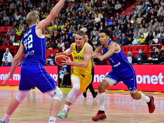 Finland s Daniel Dolenc and Shawn Huff tries to stop Sweden s Ludde Hakanson during the Fiba World Cup European qualifier basketball match, 1st round Group C, between Sweden and Finland at Avicii Arena in Stockholm, Sweden November 25, 2021. STOCKHOLM Sweden x10030x