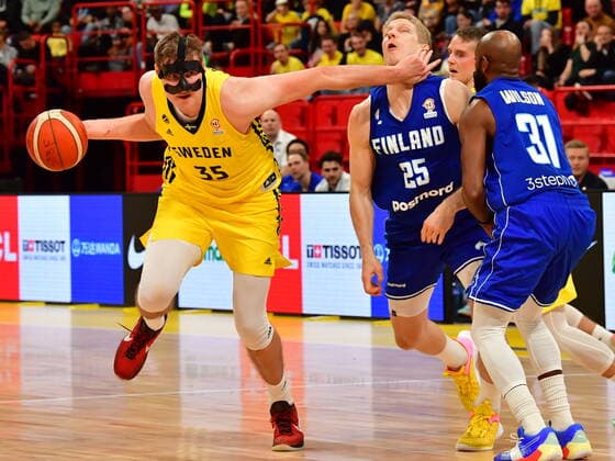 Sweden s Simon Birgander against Finland s Juho Nenonen and Jamar Wilson during the Fiba World Cup European qualifier basketball match, 1st round Group C, between Sweden and Finland at Avicii Arena in Stockholm, Sweden November 25, 2021. STOCKHOLM Sweden x10030x