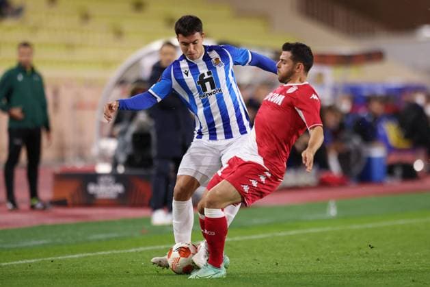 Monaco, Monaco, 25th November 2021. Kevin Volland of AS Monaco challenges Martin Zubimendi of Real Sociedad during the UEFA Europa League match at Stade Louis II, Monaco. Picture credit should read: Jonathan Moscrop Sportimage EDITORIAL USE ONLY. No use with unauthorised audio, video, data, fixture lists, club league logos or live services. Online in-match use limited to 120 images, no video emulation. No use in betting, games or single club league player publications. SPI-1343-0002