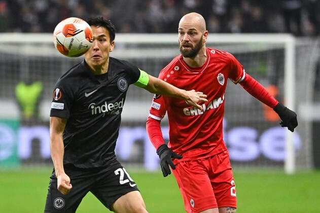 Eintracht s Makoto Hasebe and Antwerp s Dorian Dessoleil fight for the ball during a soccer game between German Eintracht Frankfurt and Belgian Royal Antwerp FC, Thursday 25 November 2021 in Frankfurt, Germany, game five (out of six) in Group D of the UEFA Europa League group stage. LAURIExDIEFFEMBACQ  x3143548x