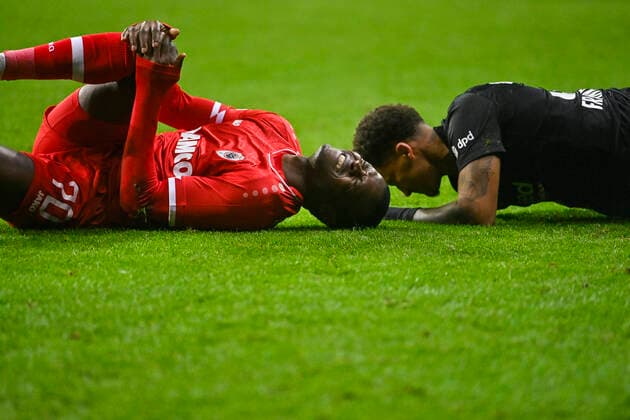 Antwerp s Ally Samatta Mbwana and Eintracht s Tuta lie injured on the ground during a soccer game between German Eintracht Frankfurt and Belgian Royal Antwerp FC, Thursday 25 November 2021 in Frankfurt, Germany, game five (out of six) in Group D of the UEFA Europa League group stage. LAURIExDIEFFEMBACQ  x3143552x