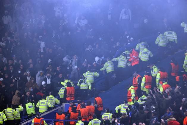 Leicester, England, 25th November 2021. Police draw their batons to keep the Legia Warsaw fans back during the UEFA Europa League match at the King Power Stadium, Leicester. Picture credit should read: Darren Staples Sportimage EDITORIAL USE ONLY. No use with unauthorised audio, video, data, fixture lists, club league logos or live services. Online in-match use limited to 120 images, no video emulation. No use in betting, games or single club league player publications. SPI-1341-0062