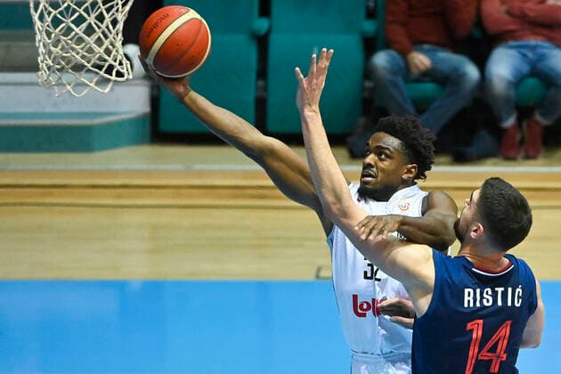 Belgium s Retin Obasohan and Serbia s Dusan Ristic fight for the ball during a match of the national basketball team of Belgium, the Red Lions, against the national team, Nationalteam of Serbia, a qualification game for the 2023 World Championship, WM, Weltmeisterschaft men, in the Group A (match 2 6), Sunday 28 November 2021. LAURIExDIEFFEMBACQ  x3145234x