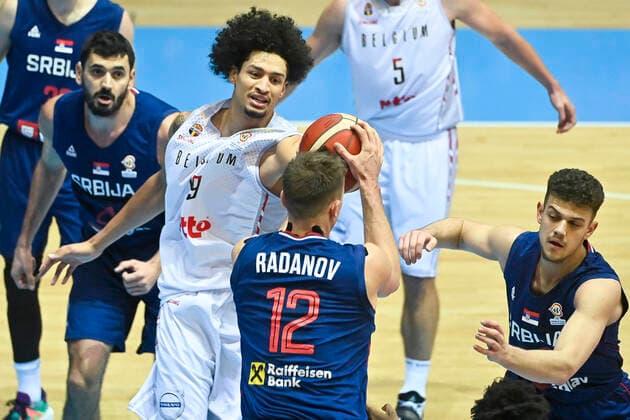 Belgium s Ismael Bako and Serbia s Aleksa Radanov fight for the ball during a match of the national basketball team of Belgium, the Red Lions, against the national team, Nationalteam of Serbia, a qualification game for the 2023 World Championship, WM, Weltmeisterschaft men, in the Group A (match 2 6), Sunday 28 November 2021. LAURIExDIEFFEMBACQ  x3145249x