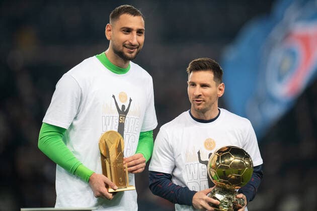 (211202) -- PARIS, Dec. 2, 2021 -- Lionel Messi (R) and Gianluigi Donnarumma of Paris Saint Germain display their trophies of 2021 Ballon d or before a French Ligue 1 football match between Paris Saint Germain (PSG) and Nice in Paris, France, Dec. 1, 2021. (Photo by Jach Chan Xinhua) (SP)FRANCE-PARIS-FOOTBALL-LEAGUE 1-PSG VS NICE JiexKe¡¤chen 