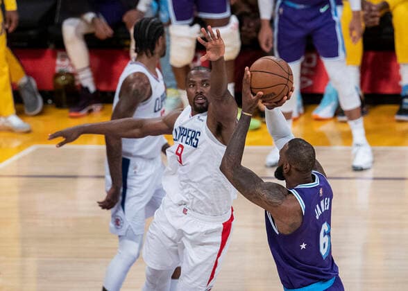 December 3, 2021, Los Angeles, California, USA: Serge Ibaka 9 of the Los Angeles Clippers defends against LeBron James 6 of the Los Angeles Lakers during their regular season NBA, Basketball Herren, USA game on Friday December 3, 2021 at the Staples Center in Los Angeles, California. Lakers lose to Clippers, 115-119. PI Los Angeles USA - ZUMAp124 20211203_zaa_p124_038 Copyright: xJAVIERxROJASx