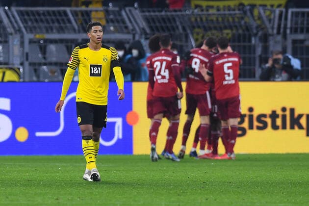 Fußball 1. Bundesliga 14. Spieltag Borussia Dortmund - FC Bayern München am 04.12.2021 im Signal Iduna Park in Dortmund Torjubel Jubel zum 1:2 durch Kingsley Coman ( München ), hinten - Jude Bellingham ( Dortmund ) enttäuscht, vorne DFL regulations prohibit any use of photographs as image sequences and or quasi-video.