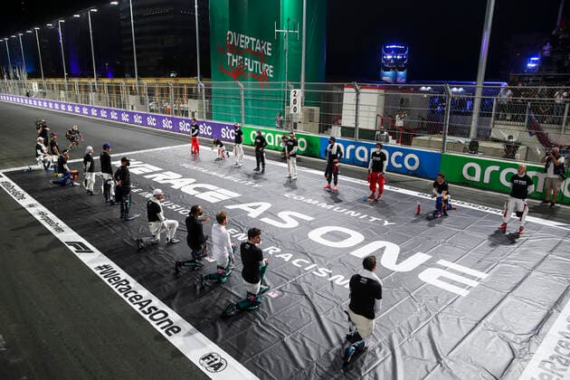 F1 drivers stand and kneel on the grid in support of the End Racism campaign, F1 Grand Prix of Saudi Arabia at Jeddah Corniche Circuit on December 5, 2021 in Jeddah, Saudi Arabia. (Photo by HOCH ZWEI) Jeddah Saudi Arabia